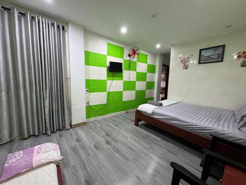 Кровать или кровати в номере Bảo Trân Boutique Motel gần Sân Bay Và Trung Tâm