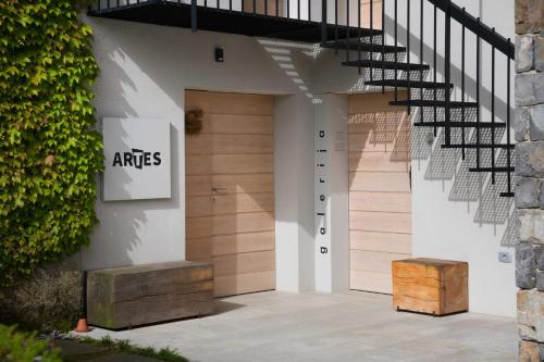 an entrance to a building with stairs and a door at Villa Artes with Free Hot Tub & Sauna in Branik