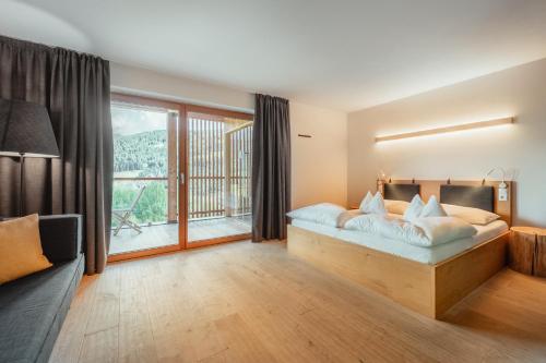 Postel nebo postele na pokoji v ubytování Gailerhof Hotel B&B Superior