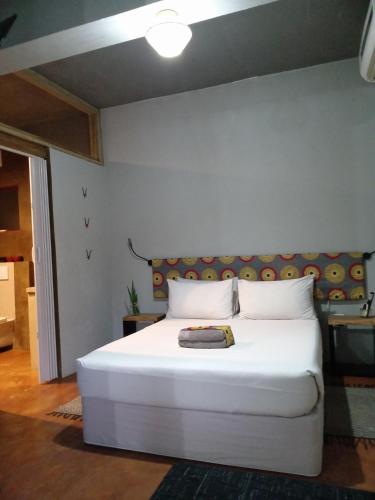 a bedroom with a large white bed in a room at Travelers Nest in St Lucia