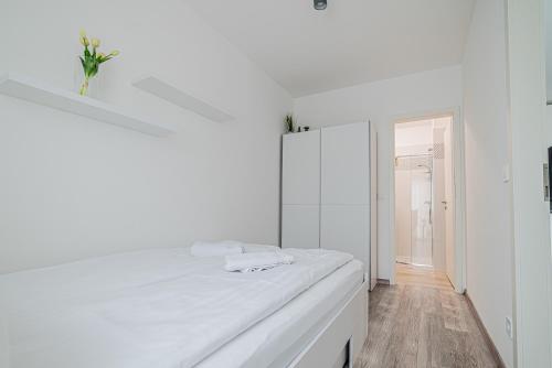 Ένα ή περισσότερα κρεβάτια σε δωμάτιο στο Móra Apartman