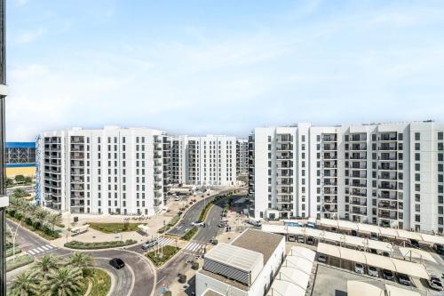 an aerial view of a city with white buildings at Yas Escape -2BR by SLV in Abu Dhabi
