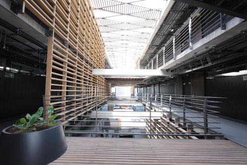 a hallway in a building with a large ceiling at Nucleo Mayor Apart in Santiago