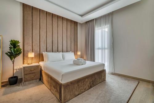 Una cama o camas en una habitación de Yas Escape -2BR by SLV