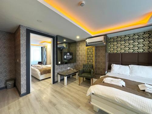Postel nebo postele na pokoji v ubytování Akayda Butik Hotel