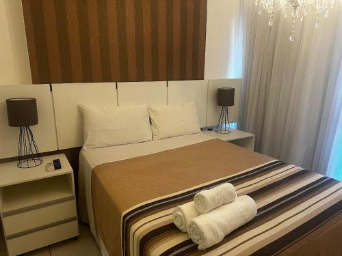 Ένα ή περισσότερα κρεβάτια σε δωμάτιο στο Lindo flat no centro de Brasilia