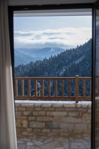 a view of a mountain from a window at Κόρυς in Karpenision
