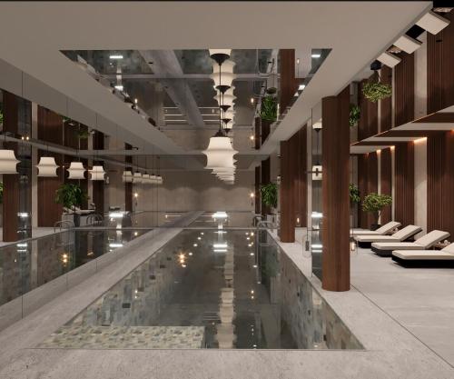 a lobby with a pool in the middle of a building at Villa Sahrai, a Member of Design Hotels in Casablanca