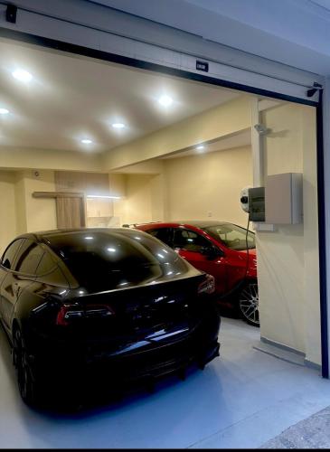 a garage with two cars parked in it at THESS OLD TOWN 2 free private parking of stayinthess in Thessaloniki