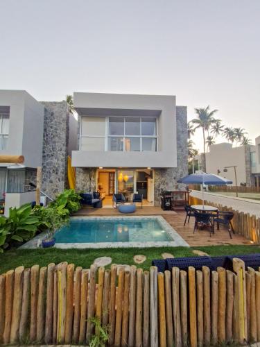 Πισίνα στο ή κοντά στο Casa Boho-Rota dos Milagres-Condomínio pé na areia