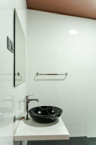 a black sink on a white counter in a kitchen at Green Peak - Mountain View Hotel & Restaurant in Ella