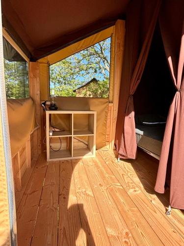 an inside view of a tent with a window at Camping Onlycamp Pierre & Sources in Volvic