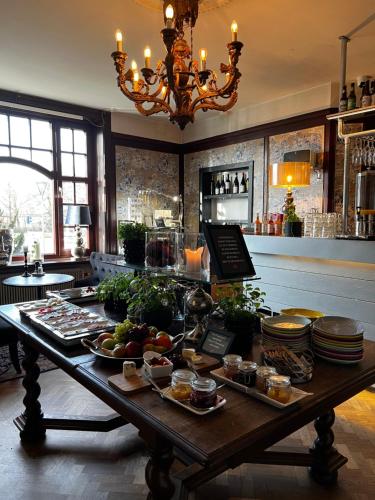 a table with food on it in a kitchen at Hotell Dannegården in Trelleborg