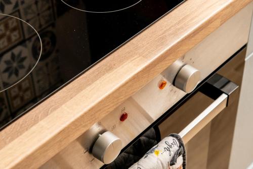 a close up of a kitchen drawer with a persons foot at Horseshoe Cottage in Bridlington