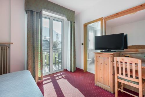 TV a/nebo společenská místnost v ubytování Hotel Lucia