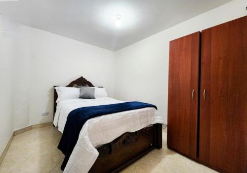 Postel nebo postele na pokoji v ubytování Casa Ideal Medellín, Amplia, Cálida y Estratégica