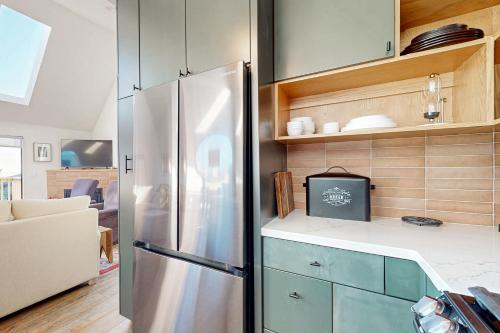 a kitchen with a stainless steel refrigerator at Heron Escape in Bodega Bay