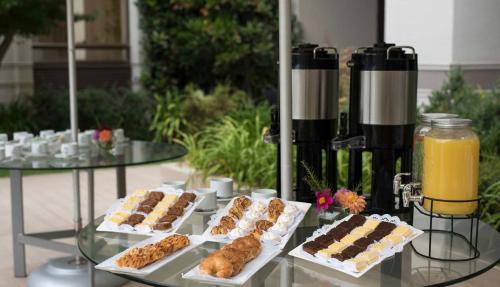 a buffet of pastries and drinks on a table at Holiday Inn Express - Concepcion by IHG in Concepción