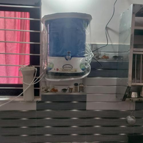 a appliance sitting on top of a stairs in a room at Jamuna homestays in Secunderabad