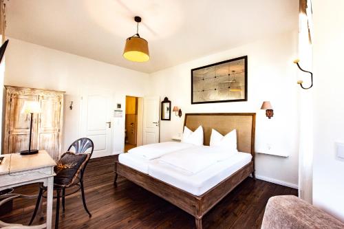 Postel nebo postele na pokoji v ubytování Hotel Villa WUN