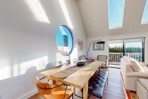 a living room with a table and a couch at Heron Escape in Bodega Bay