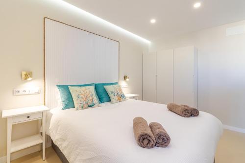 Ένα ή περισσότερα κρεβάτια σε δωμάτιο στο Puerto Rico Beachside Holidays