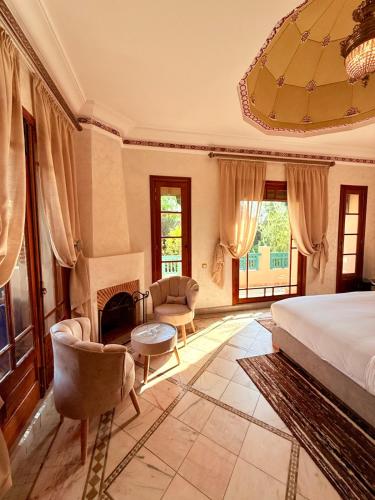 a bedroom with a bed and a fireplace at VILLA 34 - 4 Masters, Moroccan Charm & Modern Comfort with Private Pool in Marrakesh