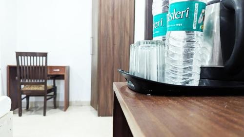 a bottle of water sitting on top of a counter at Hotel Prime By The Premium Villa in New Delhi