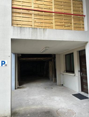 an empty garage in a building with a door at The Secrets Jungle in Altkirch