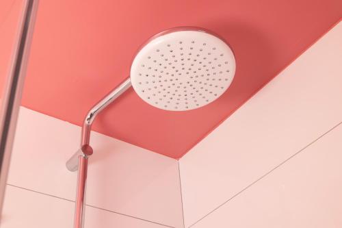 a shower head on the ceiling of a room at Hotel La Folie des Pres - Saint-Germain-des-Pres in Paris
