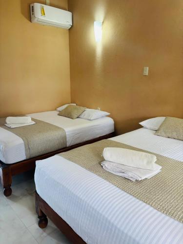 Postel nebo postele na pokoji v ubytování Hotel Rosa de los vientos