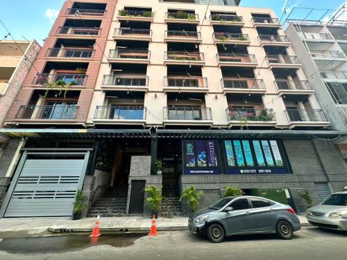 a car parked in front of a building at Amazing 1 Bedroom in Casco Viejo in Panama City
