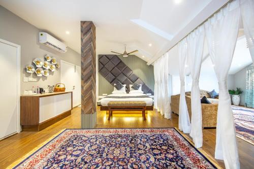a bedroom with a bed and a large window at Elegance in Nigeen in Srinagar