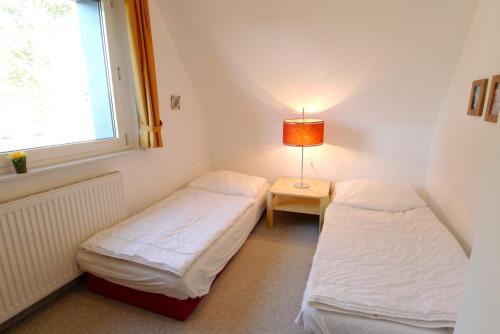 Voodi või voodid majutusasutuse Straminke 14 Haus Strandidylle toas