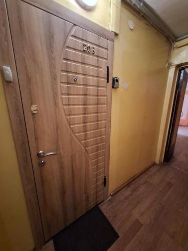 a door to a room with a sign on it at Butas KOMPaktiškas in Tauragė