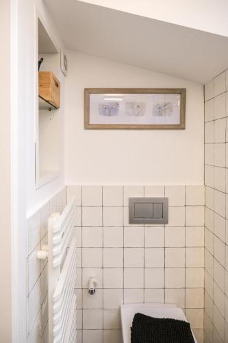 a bathroom with a sink and a toilet at El Call, Àtic con vistas al puente de Besalú in Besalú