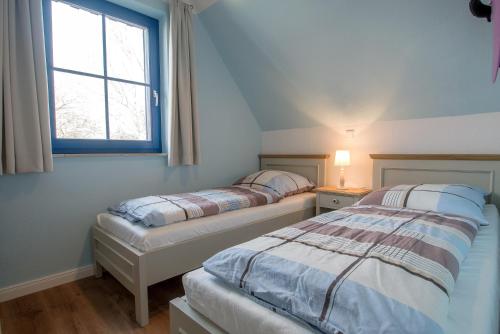 Postel nebo postele na pokoji v ubytování Wiesenstraße 65a Haus Casa Blue