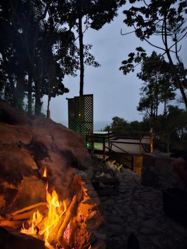 a fire pit in a park at night at Nosso Mar in Florianópolis