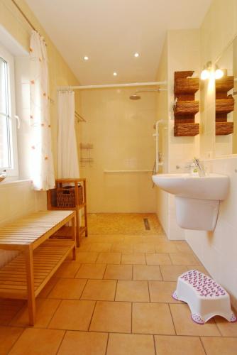 a bathroom with a sink and a toilet and a shower at Waldstrasse 15 Haus Seepferdchen in Zingst