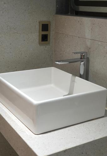 a white sink sitting on top of a counter at Suites El Ghailani in Dakhla