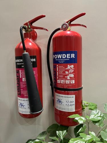 two fire hydrants are sitting next to each other at Courteous Hotel in Islamabad