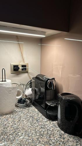a kitchen counter with a toaster on top of it at cozy apartment with pool in Ed Dechiouar