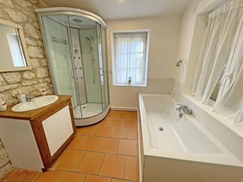 a bathroom with a shower and a tub and a sink at Propriété au calme avec piscine privée au cœur des vignes de Bergerac - FR-1-824-1 in Gageac-et-Rouillac