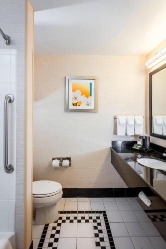 a bathroom with a toilet and a sink at Fairfield Inn & Suites Auburn Opelika in Opelika