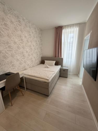 Postel nebo postele na pokoji v ubytování Hotel Astra