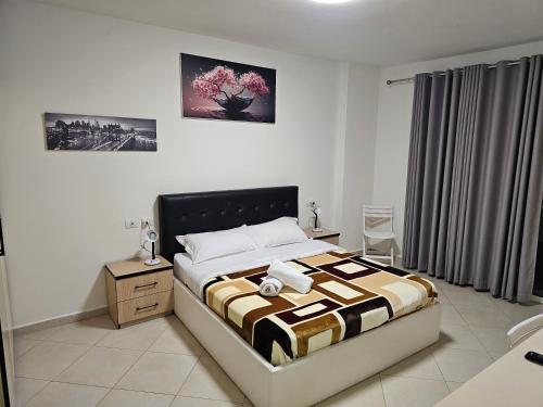 En eller flere senge i et værelse på Apartament Seaview