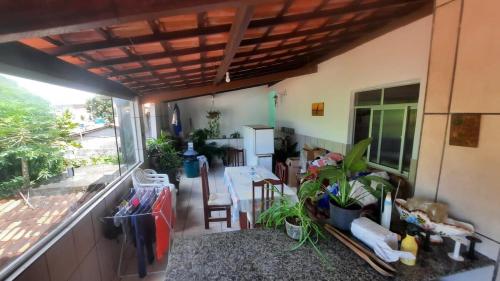 a view of a room with a balcony with plants at Casa Ilha de Vera Cruz - Bahia in Vera Cruz de Itaparica