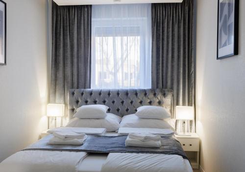 Ένα ή περισσότερα κρεβάτια σε δωμάτιο στο Relax Apartman Free Parking