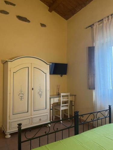 Ένα ή περισσότερα κρεβάτια σε δωμάτιο στο La Locanda degli Amici