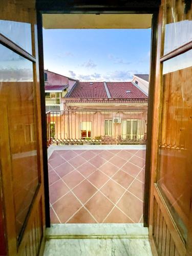 a view of a courtyard from an open window at Casa La Saletta in Torrenova